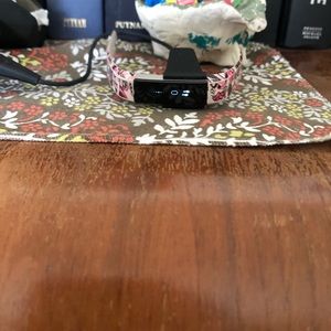 fitbit with pink heart band